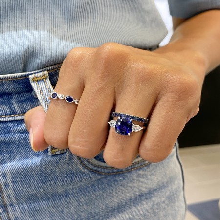 Bezel Set Oval Blue and White Sapphire Eternity Band flat