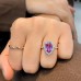 pink sapphire halo engagement ring with rose gold band lifestyle