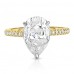 two tone engagement ring design with yellow gold band