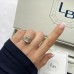 4.05 carat Emerald Cut Lab Diamond Signature Wrap Ring lifestyle box